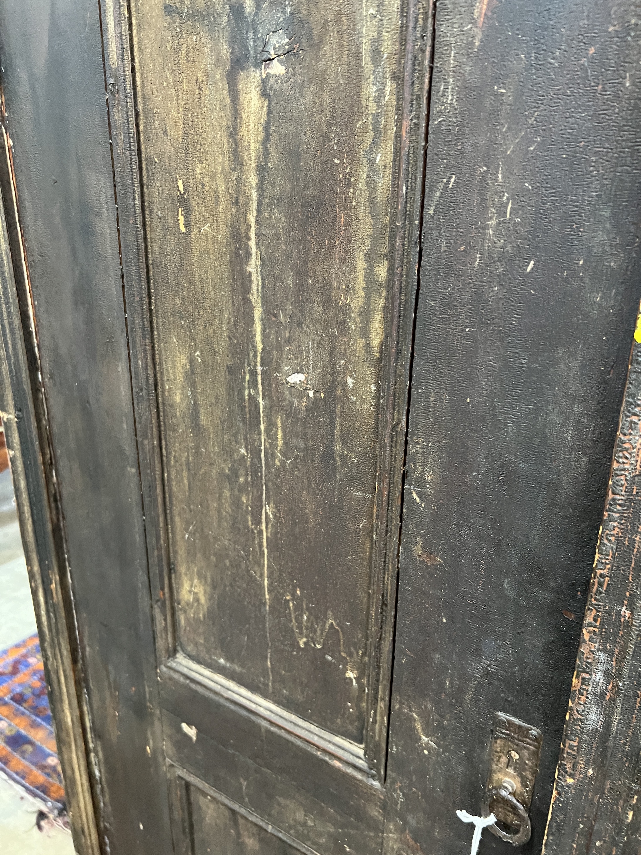 A 19th century East European stained pine household cupboard, width 105cm, depth 50cm, height 182cm